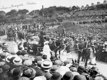 A large crowd watches Emily Wilding Davison's funeral procession leaving Morpeth station, 15th June 1913.